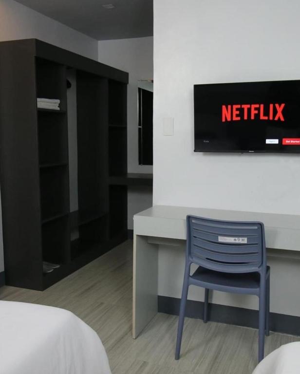 TV a/nebo společenská místnost v ubytování SANDS Hotel Nasugbu