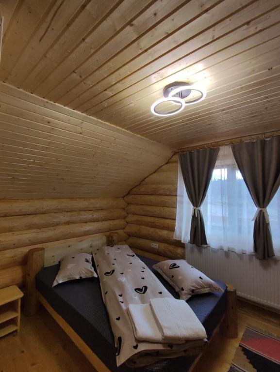 Postel nebo postele na pokoji v ubytování Cabana Colț De Munte