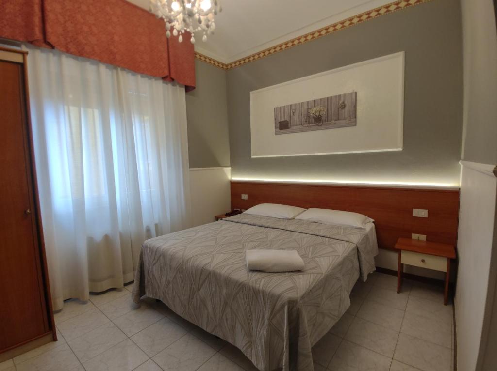 Кровать или кровати в номере Hotel Minerva