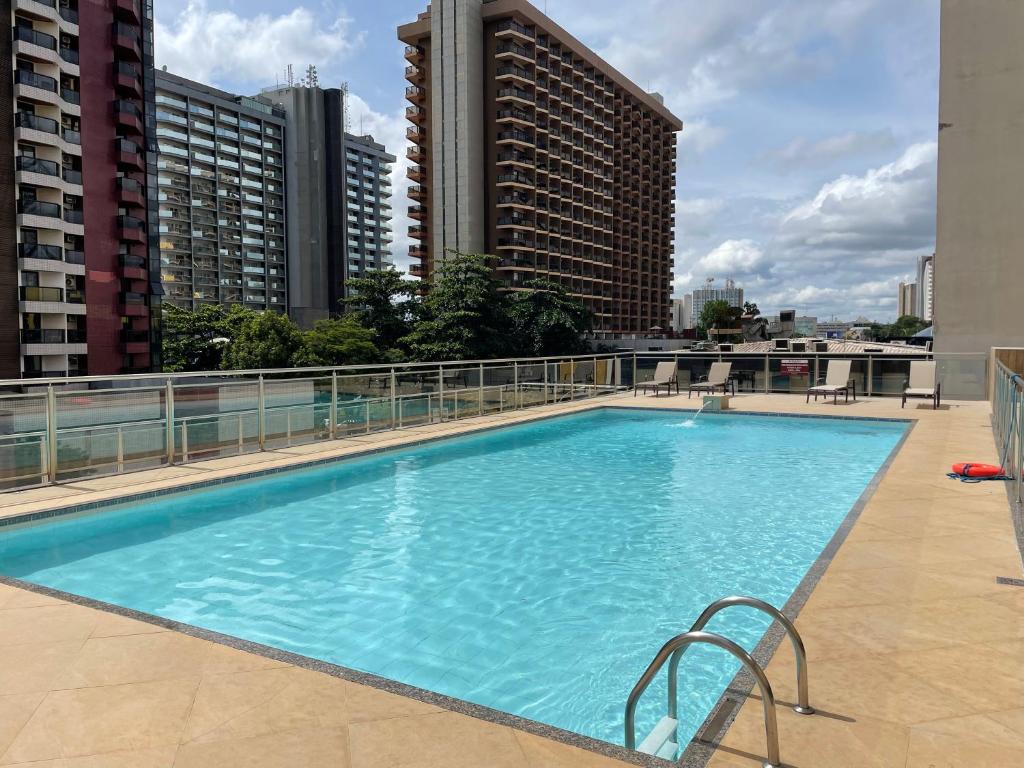 a large swimming pool on the roof of a building at MIX APART Hotel in Brasília