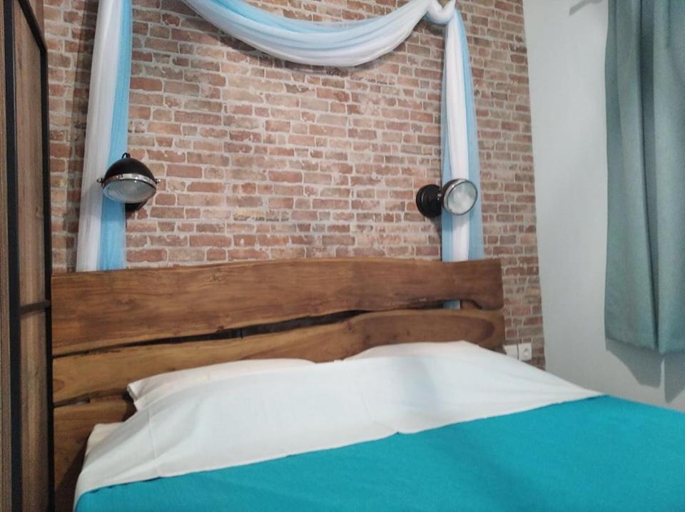 Postel nebo postele na pokoji v ubytování Kadmilos suites Samothraki