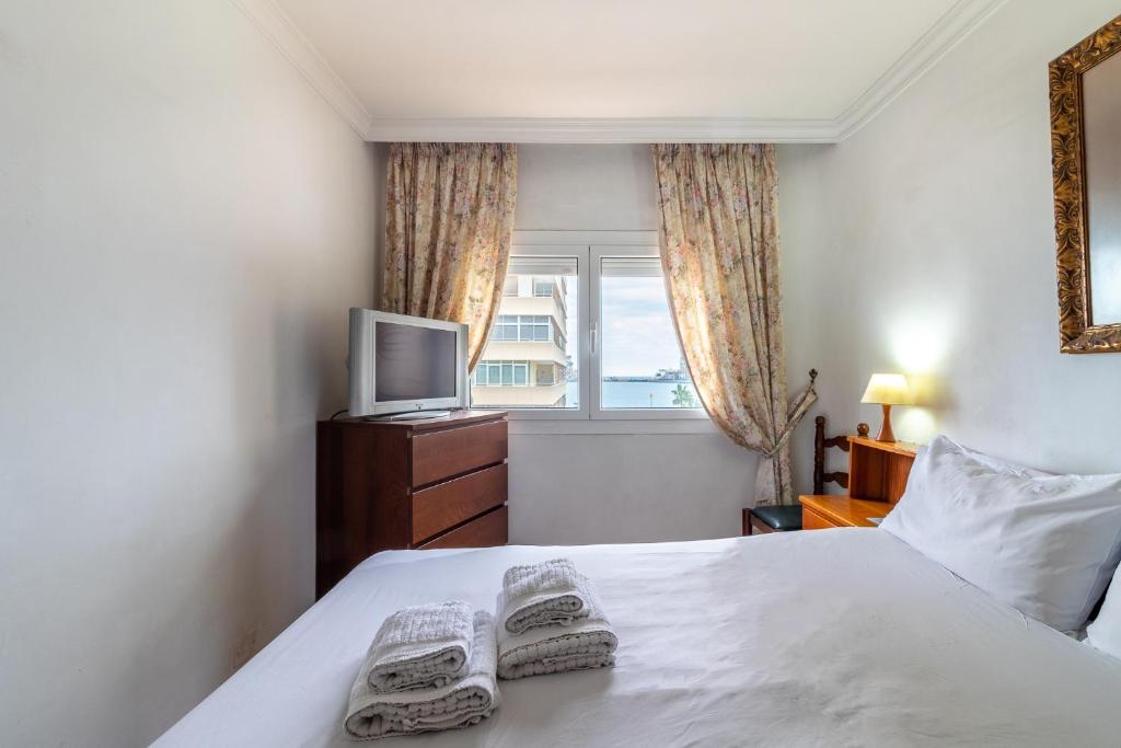 A bed or beds in a room at Flatguest Carvajal