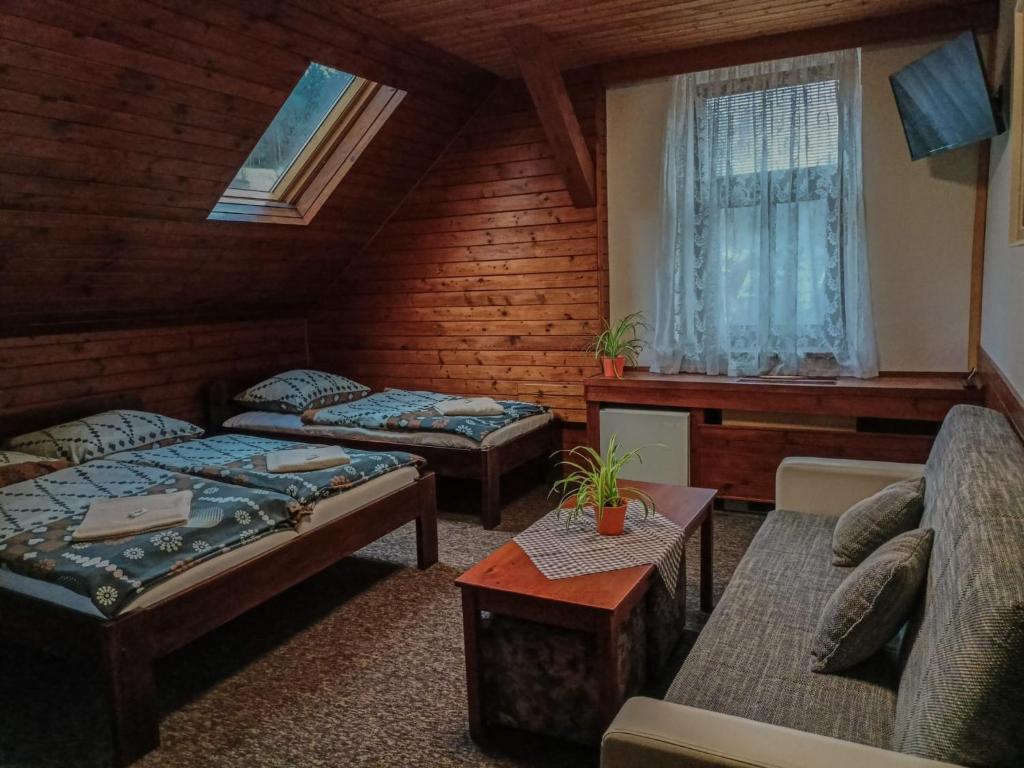 Postel nebo postele na pokoji v ubytování Penzion Rudolf