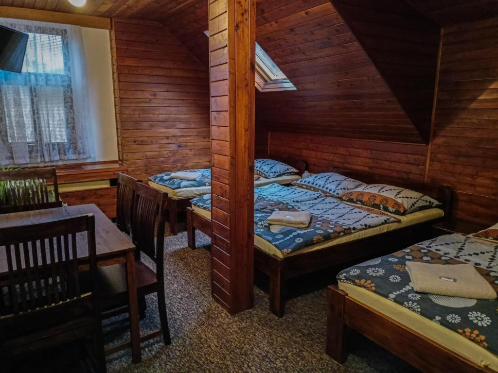 Postel nebo postele na pokoji v ubytování Penzion Rudolf
