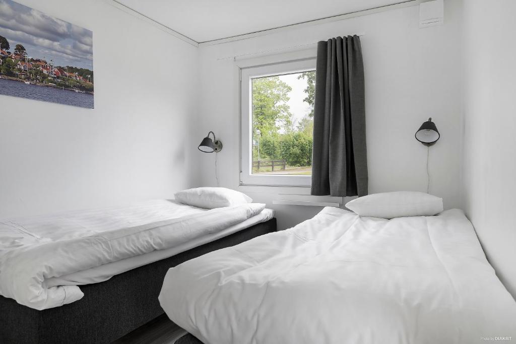 Postel nebo postele na pokoji v ubytování First Camp Skönstavik Karlskrona