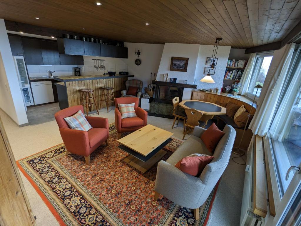 an aerial view of a living room and kitchen at Casa Sum Naul in Breil/Brigels