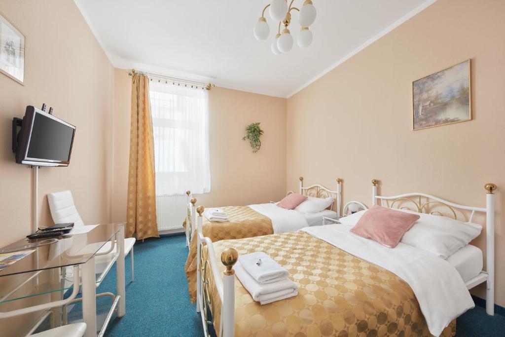 Ένα ή περισσότερα κρεβάτια σε δωμάτιο στο Hotel Roosevelt