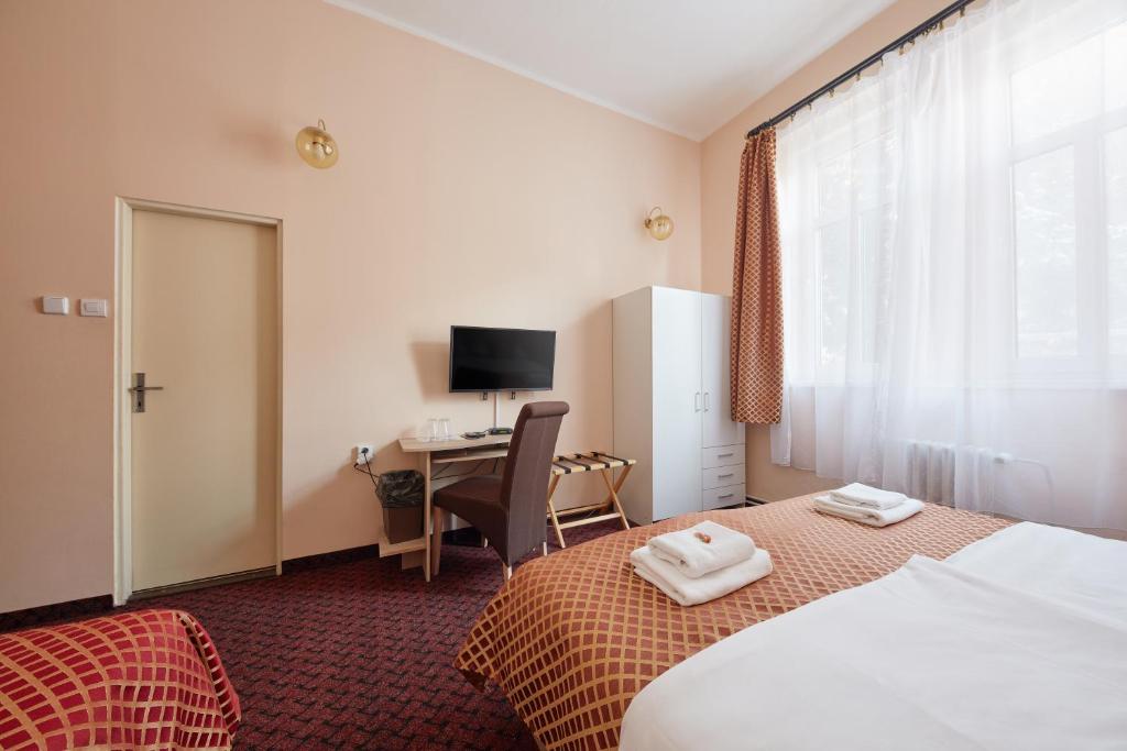 Ένα ή περισσότερα κρεβάτια σε δωμάτιο στο Hotel Roosevelt