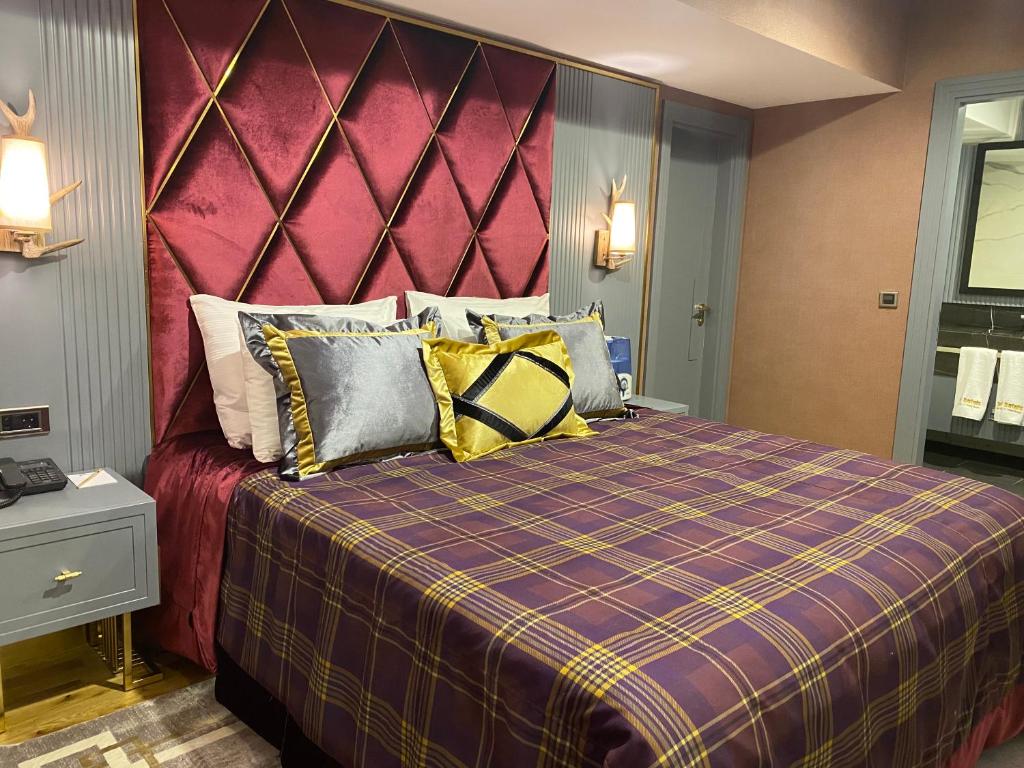 Кровать или кровати в номере Bof Hotels Uludağ Ski&Luxury Resort All Inclusive