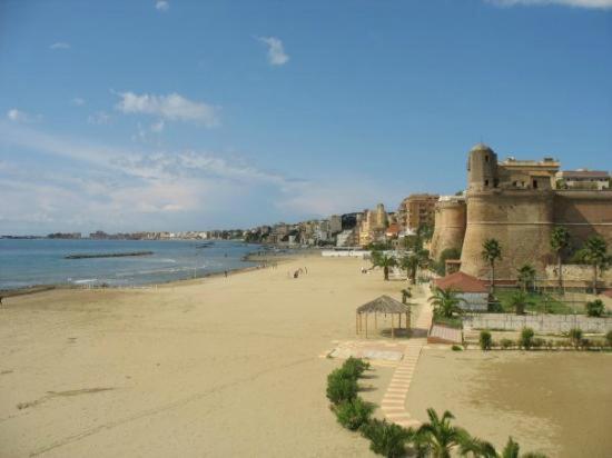 a view of a beach with buildings and the ocean at BellaVista, il tuo soggiorno vista mare! in Nettuno