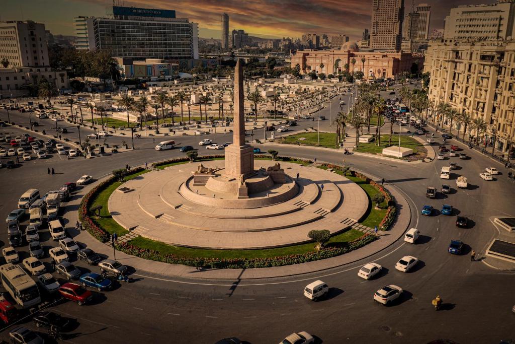 a city with cars parked in a parking lot at Ismailia House Inn in Cairo