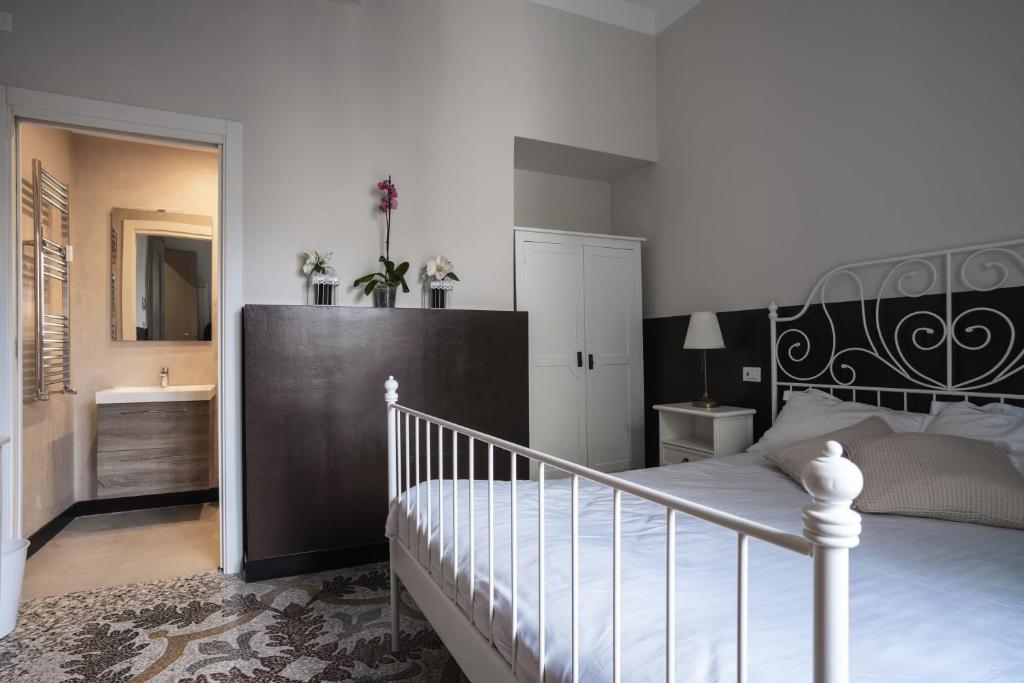 Postel nebo postele na pokoji v ubytování CORVETTO rooms