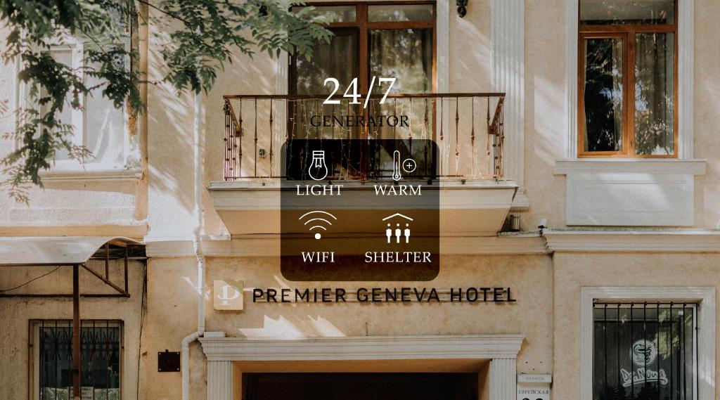 a building with a sign on the side of it at Premier Geneva Hotel in Odesa