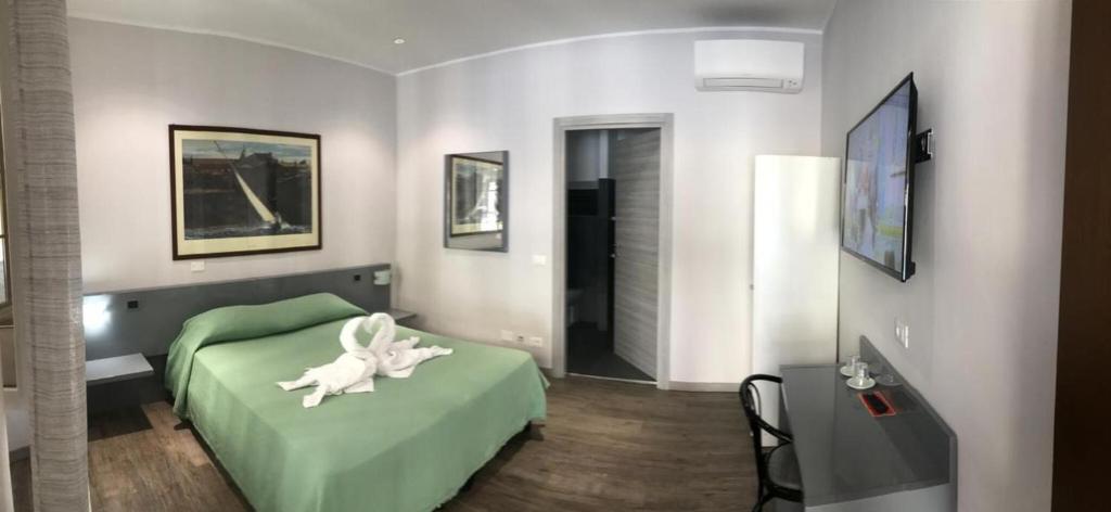 Postel nebo postele na pokoji v ubytování Hotel Convertini
