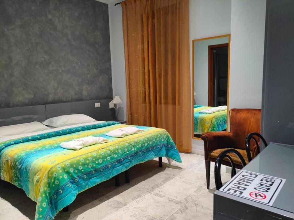 Postel nebo postele na pokoji v ubytování Hotel Convertini