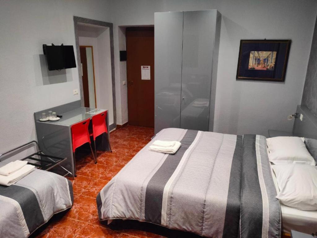 Postel nebo postele na pokoji v ubytování Hotel Convertini