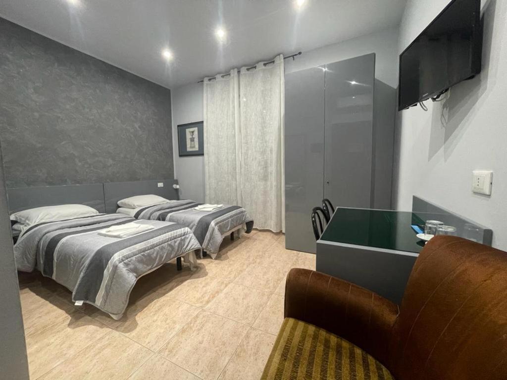 Postel nebo postele na pokoji v ubytování Hotel Convertini