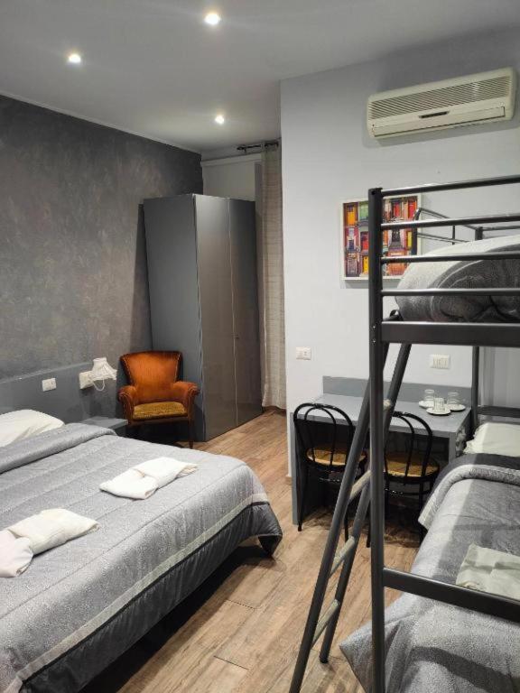 Postel nebo postele na pokoji v ubytování Hotel Convertini