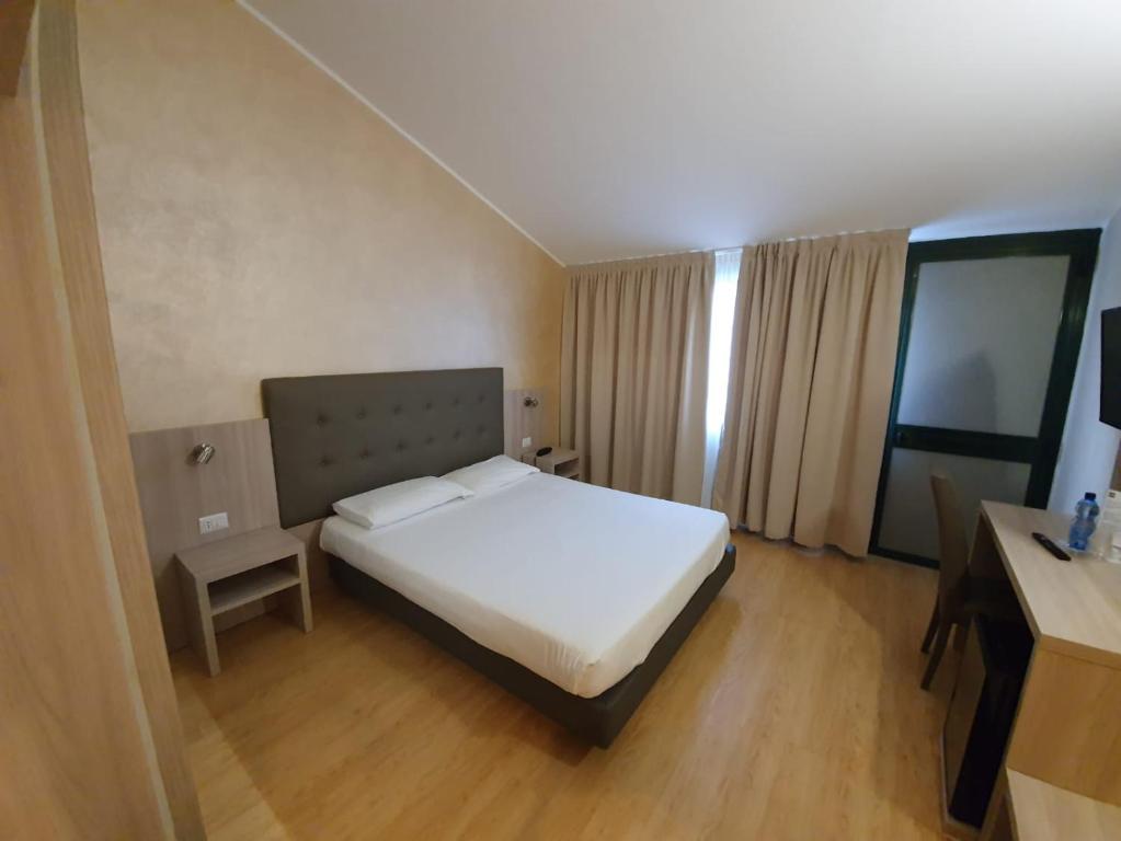 Postel nebo postele na pokoji v ubytování Green Hotel Motel