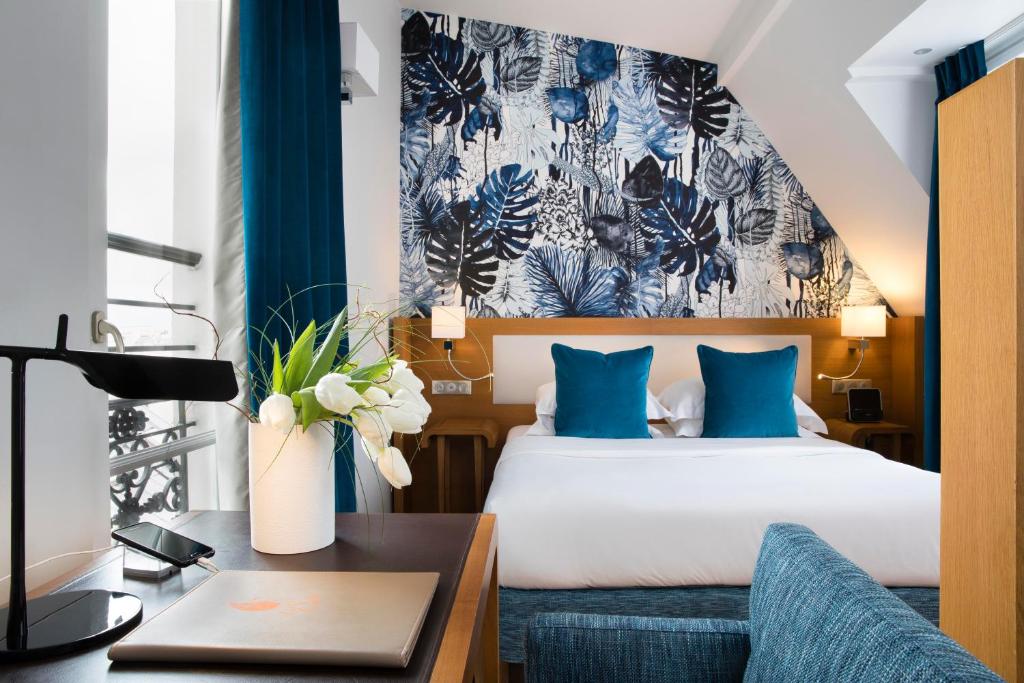 Postel nebo postele na pokoji v ubytování Hotel Le Six