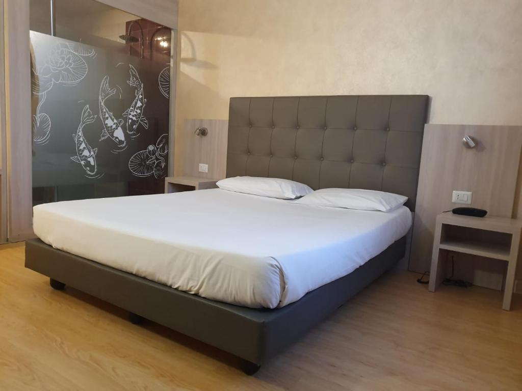 Postel nebo postele na pokoji v ubytování Green Hotel Motel