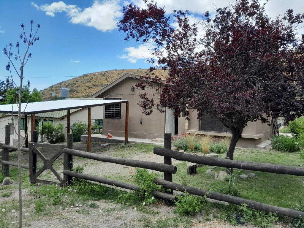 a house with a fence in front of it at AMORADA in Potrerillos