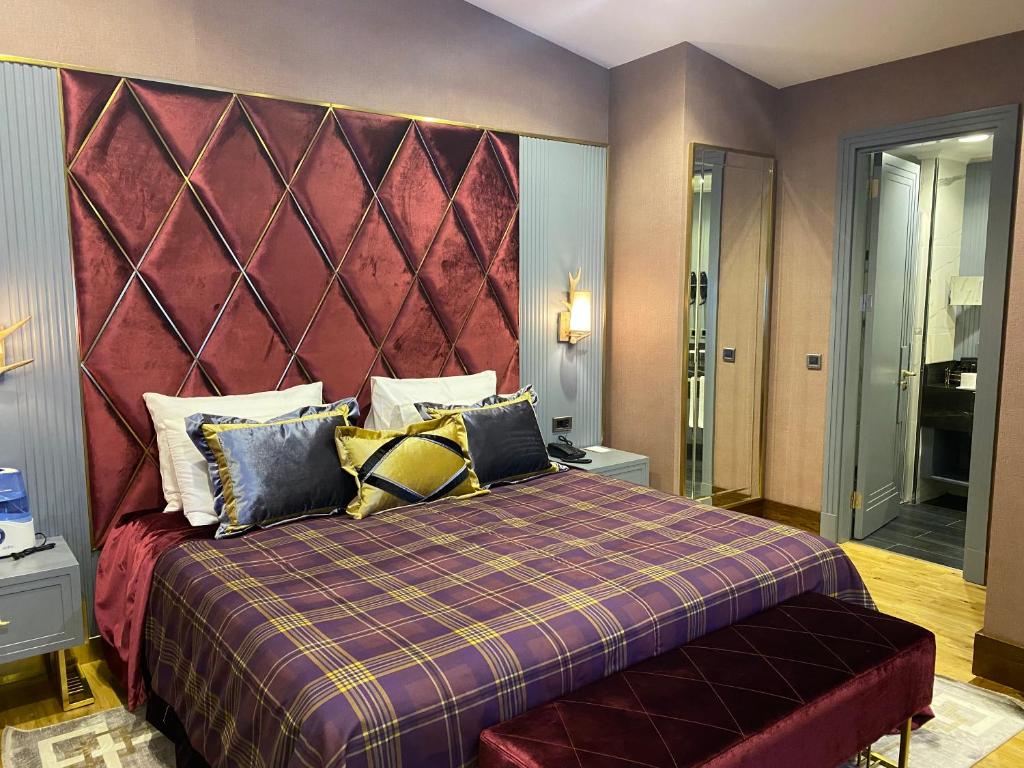 Кровать или кровати в номере Bof Hotels Uludağ Ski&Luxury Resort All Inclusive