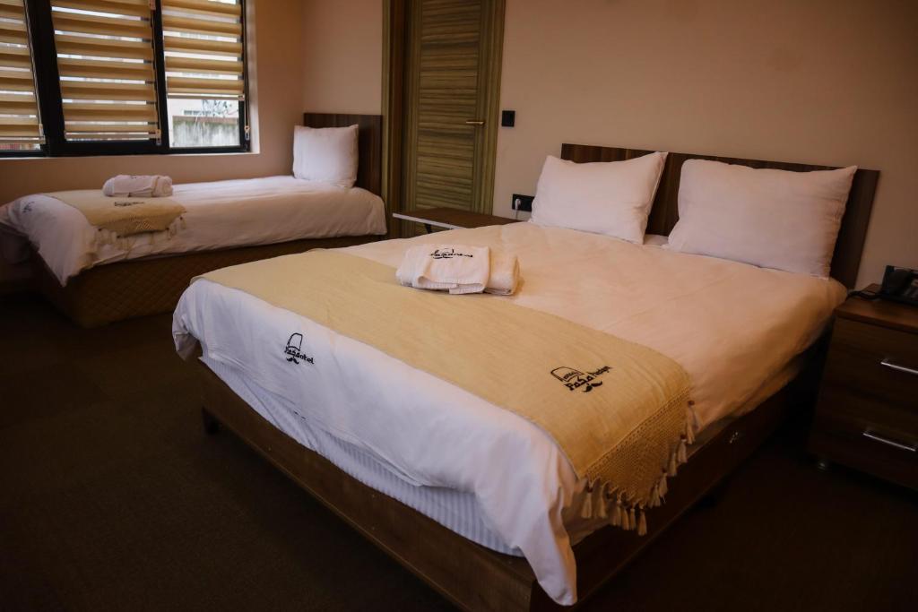 Postel nebo postele na pokoji v ubytování Osmanlı Paşa Otel- Konaklama