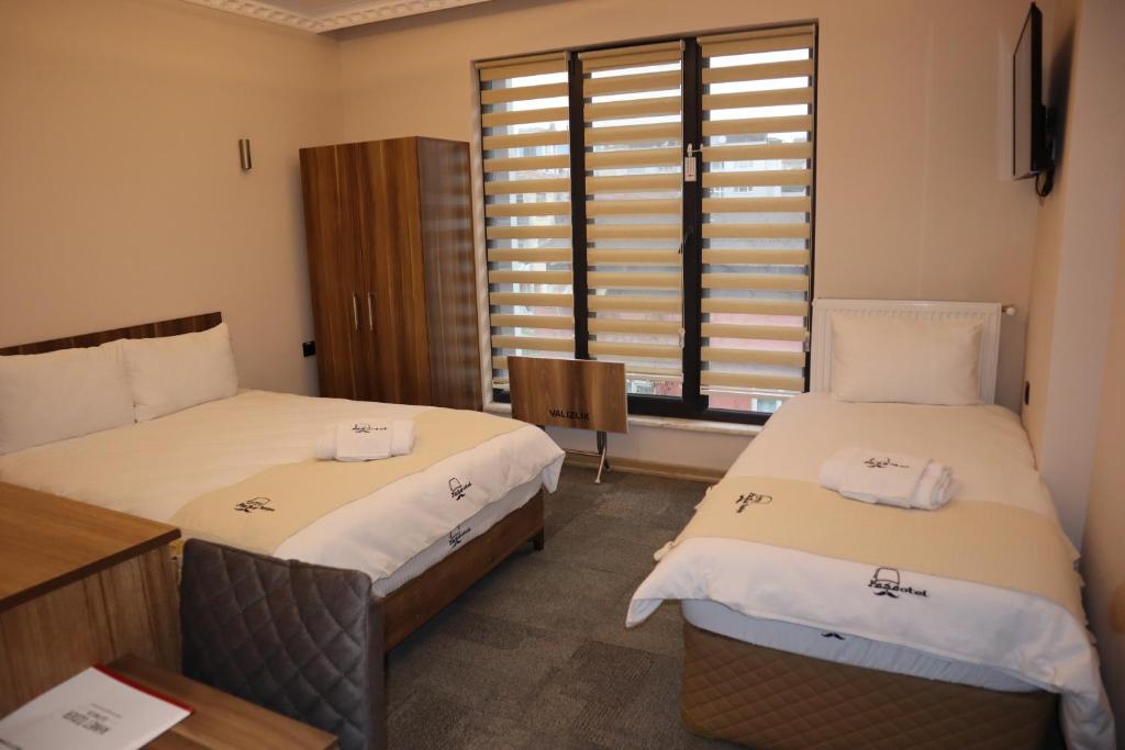Postel nebo postele na pokoji v ubytování Osmanlı Paşa Otel- Konaklama