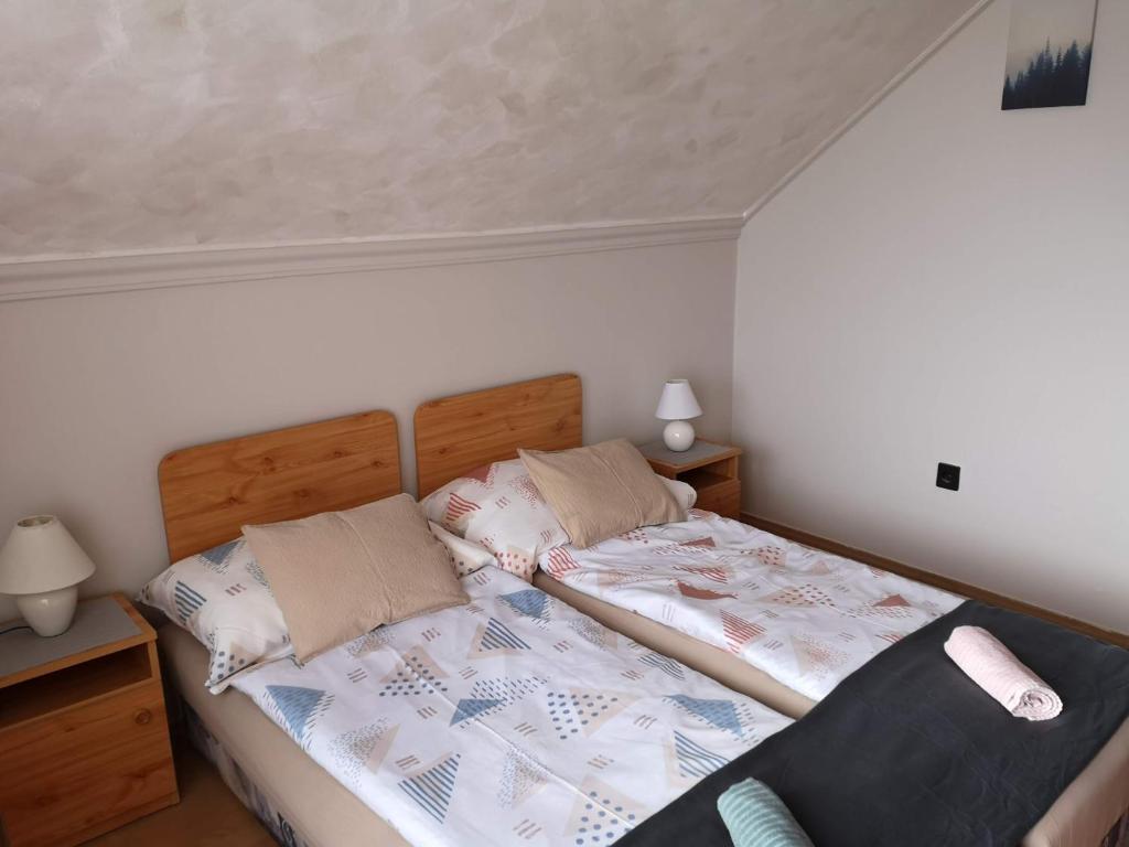 Postel nebo postele na pokoji v ubytování Aranyhal Vendégház