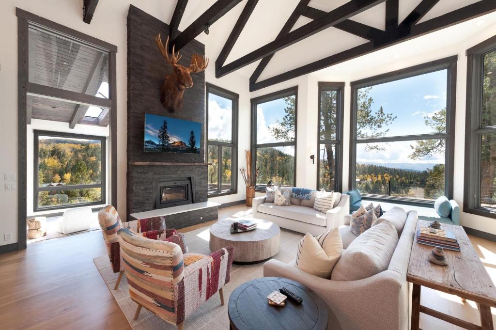 a living room with a lot of windows at 83 Ridge Road in Durango