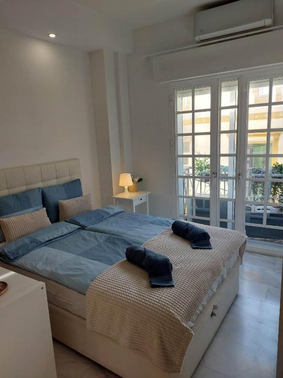 Posteľ alebo postele v izbe v ubytovaní La Malagueña Suite Zsuzsi - Centro Historico 1