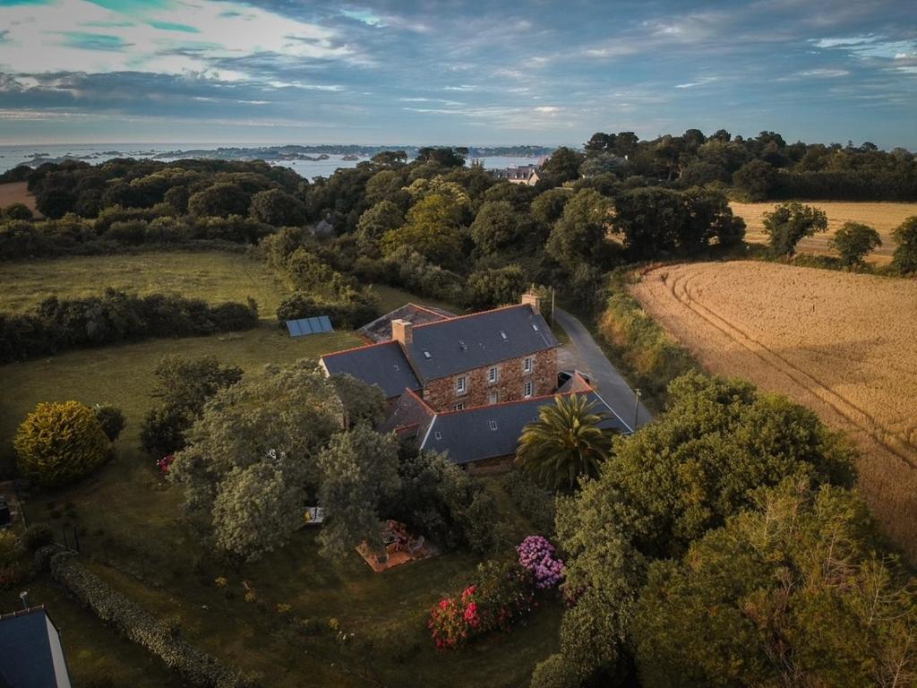 an aerial view of a house in a field at Chambres et tables d'hôtes Cornec in Ploubazlanec