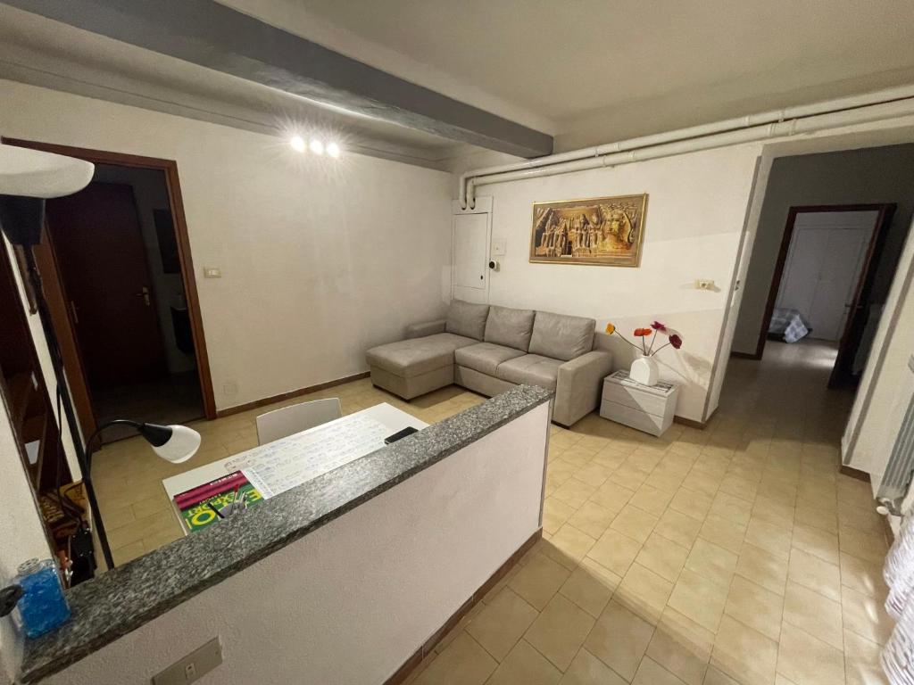 a living room with a couch and a table at Lila House in Turin