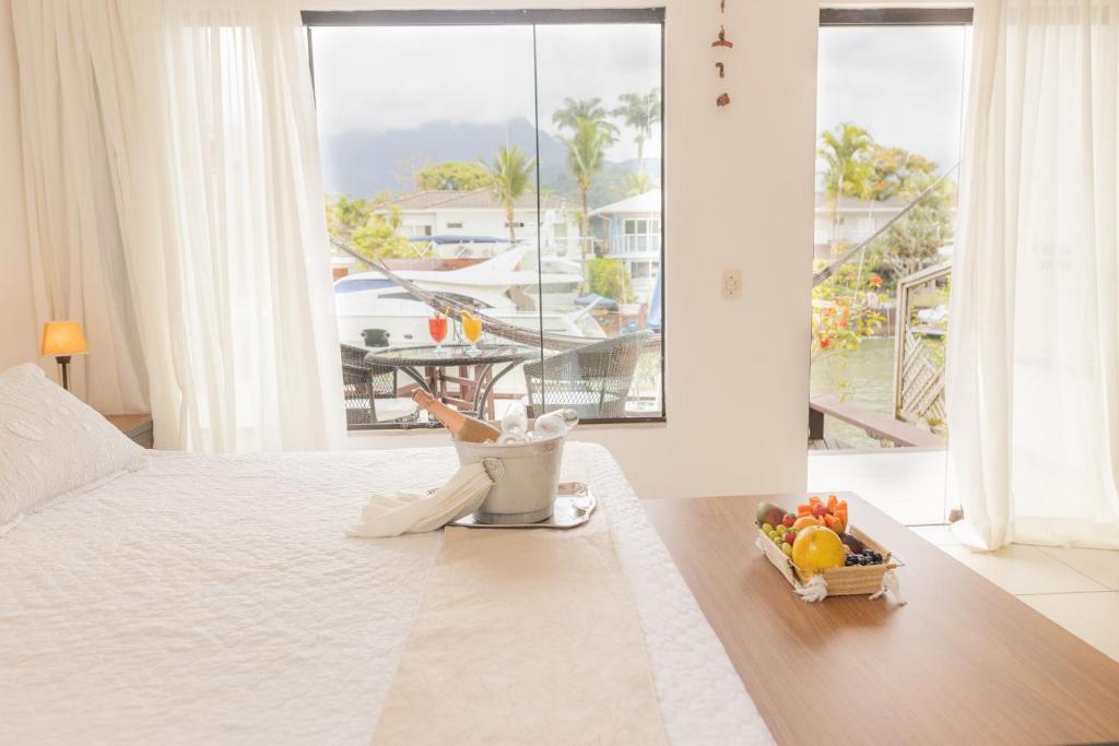 Cama ou camas em um quarto em Angra Boutique Hotel