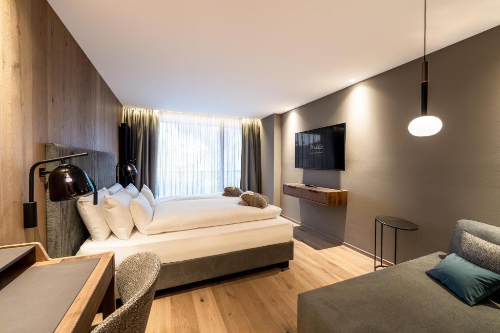 Postel nebo postele na pokoji v ubytování Stella Hotel - My Dolomites Experience