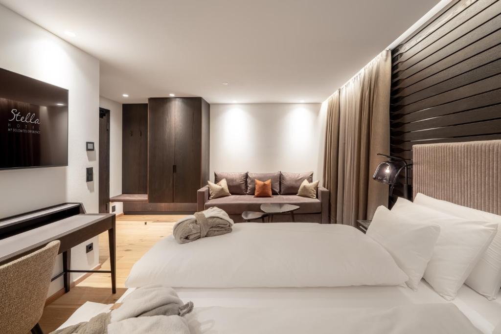 Postel nebo postele na pokoji v ubytování Stella Hotel - My Dolomites Experience