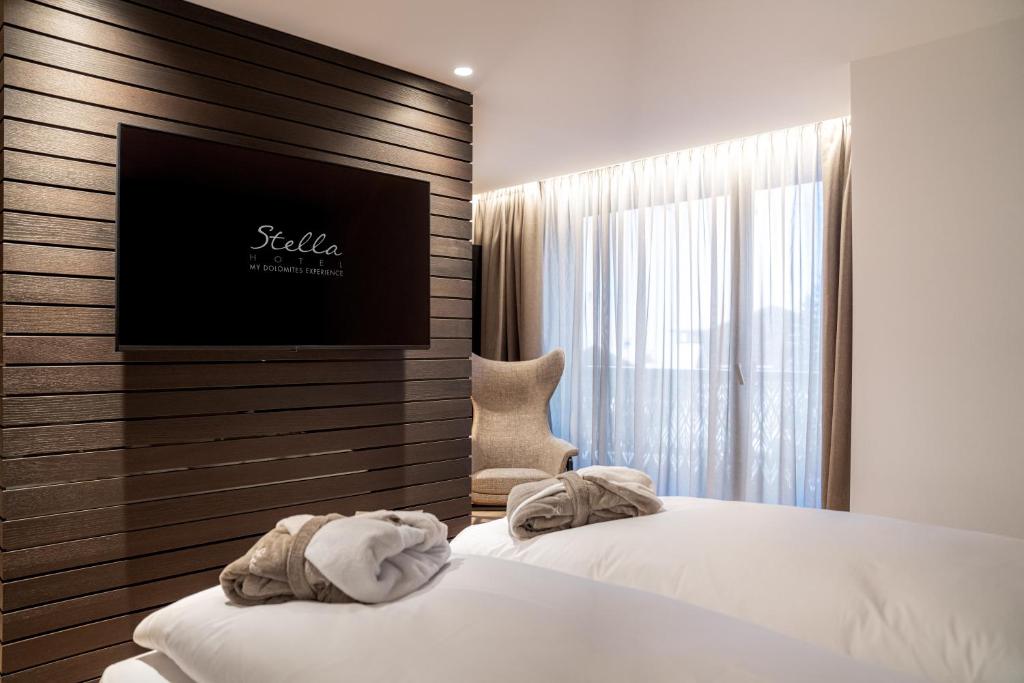 Postel nebo postele na pokoji v ubytování Stella Hotel - My Dolomites Experience