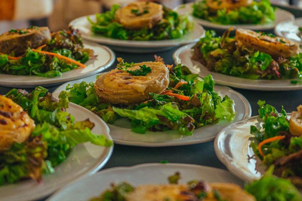 a bunch of plates of food on a table at Ecohotel Talca in Talca