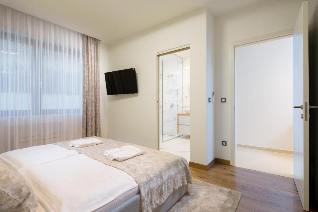 Posteľ alebo postele v izbe v ubytovaní ENA, Luxury Apartments Opatija