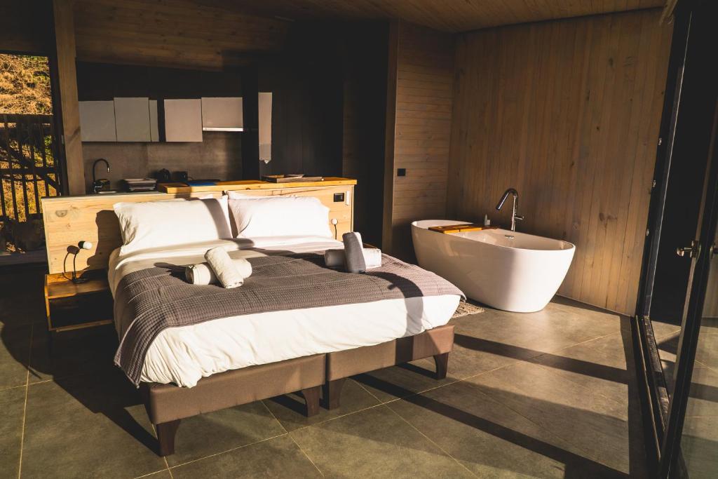 Tempat tidur dalam kamar di Pichilemu Domos