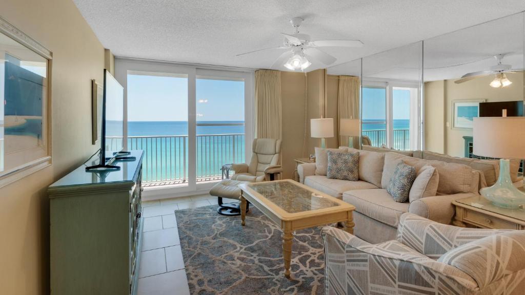 a living room with a couch and a view of the ocean at Beachcrest 903 in Santa Rosa Beach