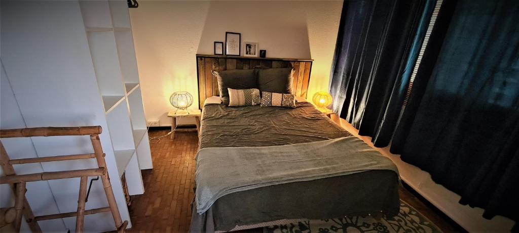 Postel nebo postele na pokoji v ubytování TITIRI Appartement