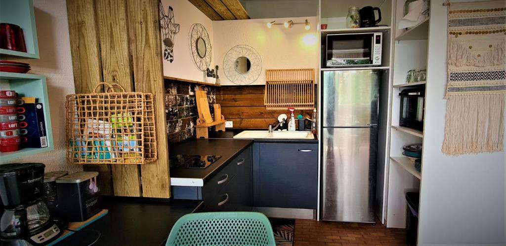 Kuchyň nebo kuchyňský kout v ubytování TITIRI Appartement