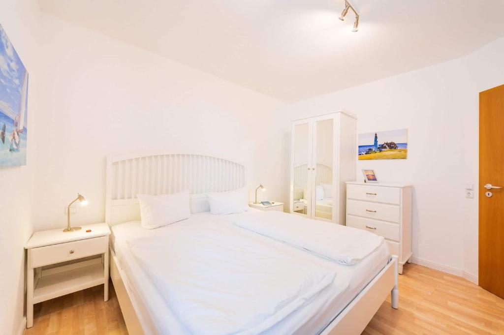 Postel nebo postele na pokoji v ubytování Meerstern