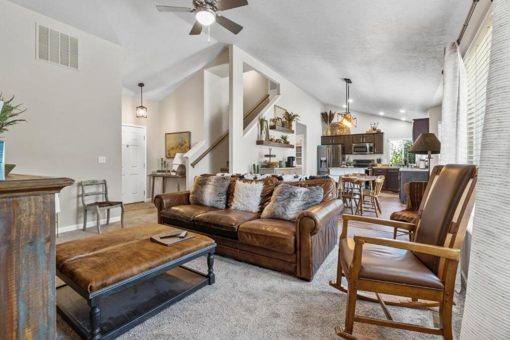 a living room with a couch and a table at Southwestern Style 4 Bedroom Nampa Home Sleeps 16! in Nampa