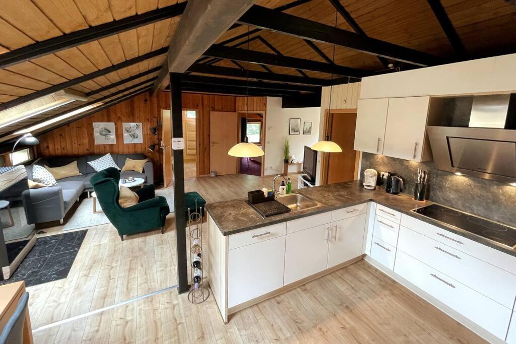 a kitchen and living room in a house at Luett Huus in Gartow