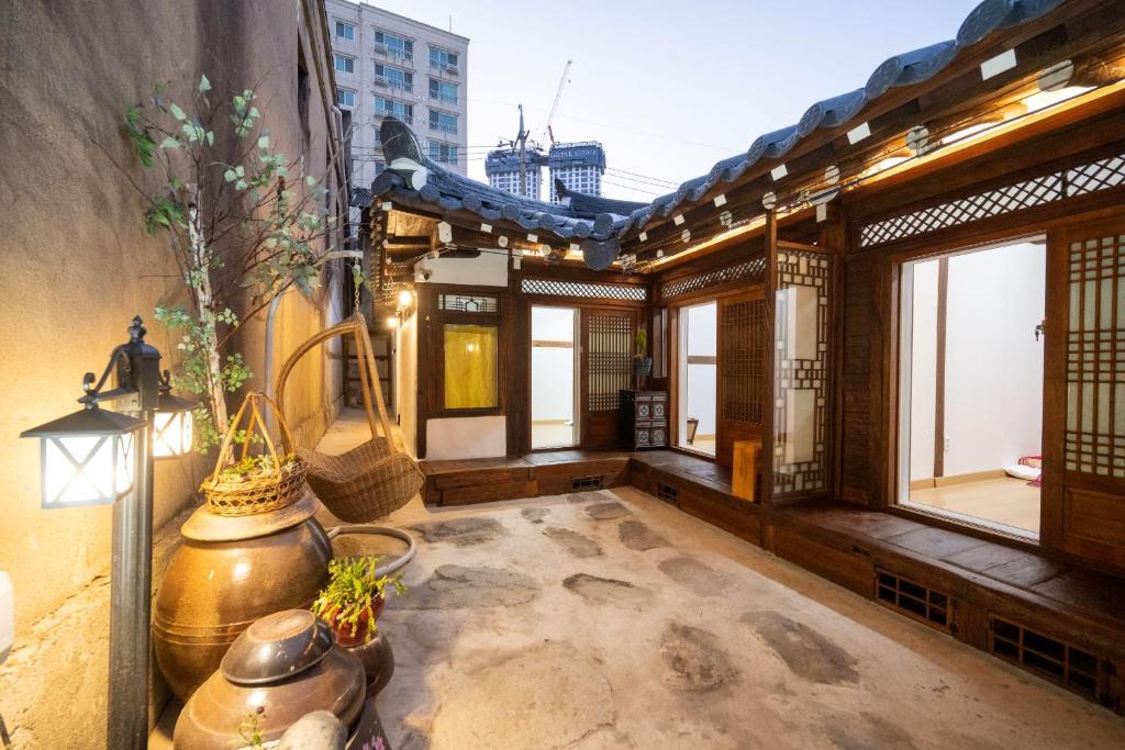 a balcony of a building with a lot of windows at Hanok1942 in Daegu