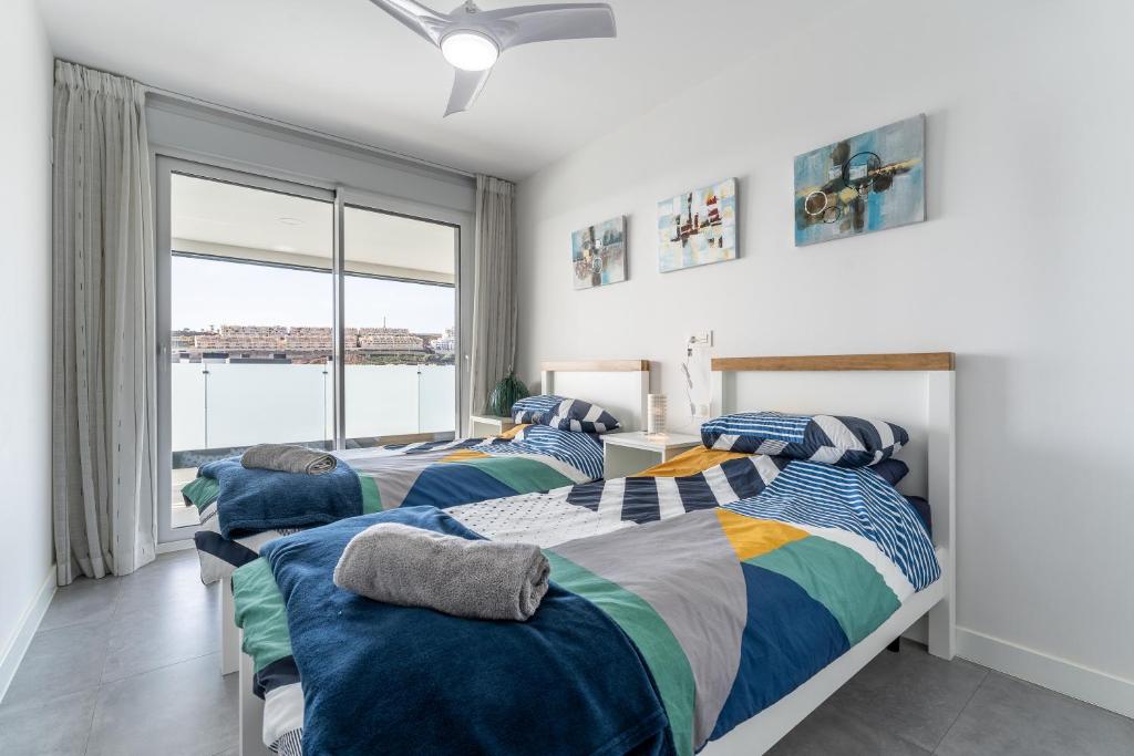 Posteľ alebo postele v izbe v ubytovaní 208 New luxury apartment Calaserena