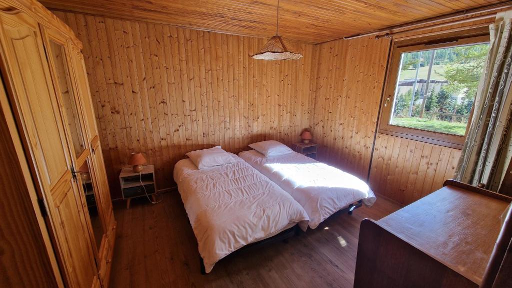 Posteľ alebo postele v izbe v ubytovaní Chalet l'Acinos
